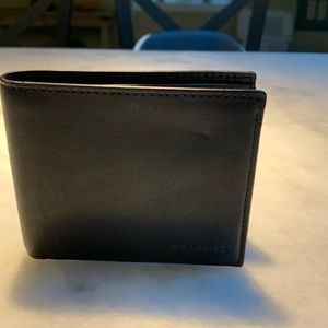 Black Coach Wallet. Never used but has marks from storage.